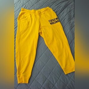FCKNXTWK Yellow Joggers